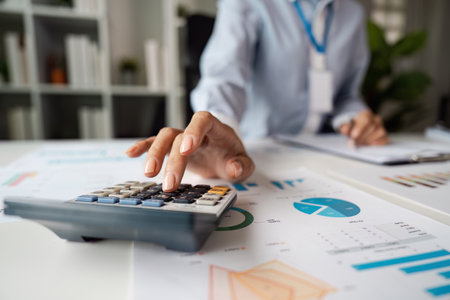 Professional Business Environment with Focus on Financial Analysis and Data Presentation in a Modern Office Settingの写真素材