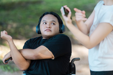 Inclusive Fitness: Friends Exercising Together Outdoors in a Park Setting with Headphones and...