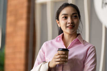 Enjoying coffee urban candid moment bright atmosphere close-up view daily life conceptの写真素材