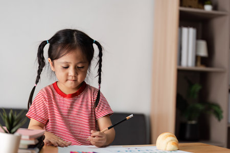 Parent and Child Engaged in Learning Activity at Home, Fostering Education and Bonding Through Creative Play and Studyの写真素材