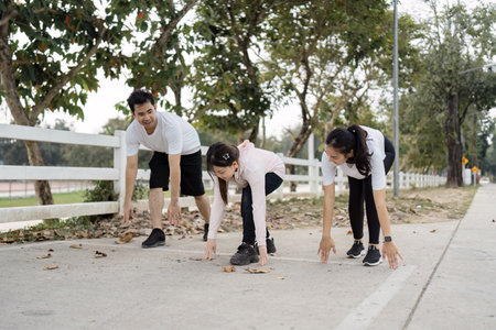 Family stretching together before a morning jog during autumn, promoting fitness and health