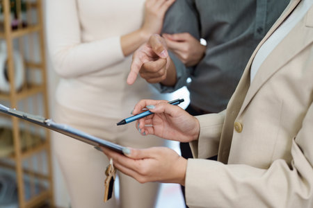 Consultative approach in real estate. Agent presenting information to clients.