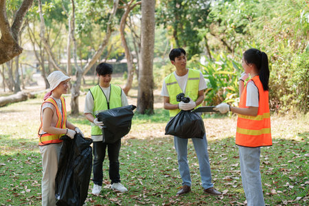 Community Service. Diverse volunteers participating in a cleanup activity in a lush park.