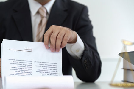 Document Review and Signature. A lawyer preparing legal documents for signature.の写真素材