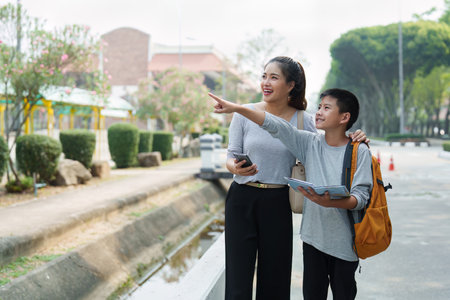 Adventure and Joyful Discovery. A son and mother exploring their surroundings with excitement.の写真素材