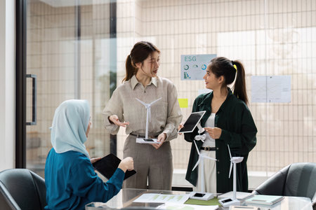 ESG Strategies and Teamwork. Professionals collaborating to promote sustainability and responsible business practices.の写真素材