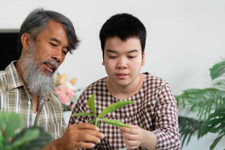 Sustainability and Intergenerational Bonding. A young girl with Down syndrome and her grandfather...