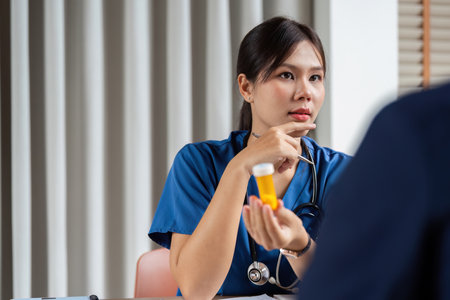 Team Doctor and Meeting. A healthcare professional presents medication details during a team...
