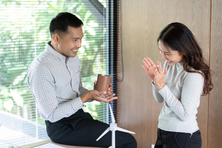 Positive Interaction. Team members sharing ideas and enjoying a light moment.の写真素材