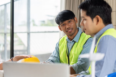 Green tech collaboration among engineers in sustainable planning meeting