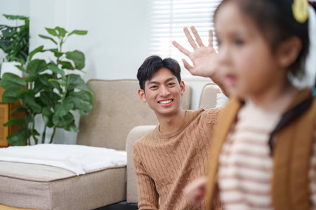 Back to School. Father and daughter bonding while preparing for school at home.の写真素材