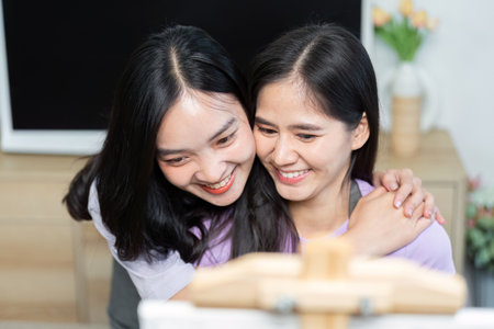Couple enjoying painting together. A moment of joy and creativity.の写真素材