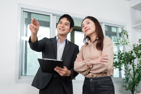 Real Estate Consultation. Agent explaining property features to a client.の写真素材