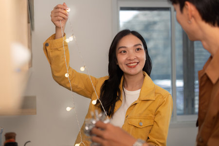 Decorating for a party, joyful moments with friends in a cozy kitchenの写真素材