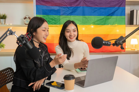 LGBTQ podcast hosts sharing insights in a vibrant studioの写真素材