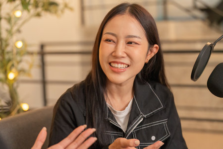 Inclusive Conversation. Young woman smiling while engaging in a discussion.の写真素材