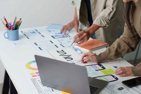 Designers Collaborating on UX UI Concepts in Bright Workspace