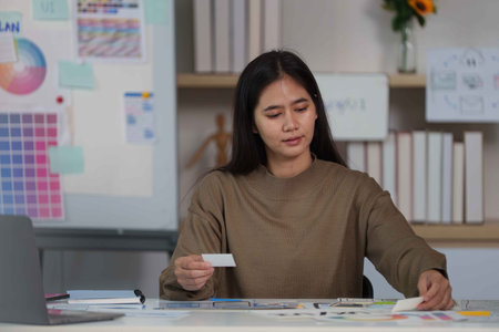 Focused Designer Organizing Ideas for Mobile App Development.の写真素材