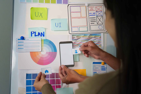 UX UI Design Collaboration. Team brainstorming with sketches and color palettes.