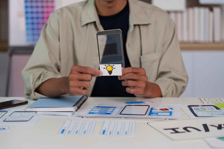 Creative Professional Presenting Mobile App Concept with Lightbulb Idea.の写真素材