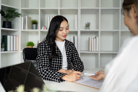 Professional Business Meeting in Modern Office with Diverse Team collaboration on Project Strategy and Planning for Successの写真素材