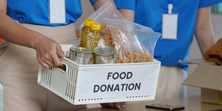 Food Donation Efforts. Volunteers preparing food donation items for community outreach.の写真素材