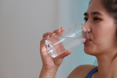 Food Wellness: Woman Hydrating with Fresh Water for Healthy Living