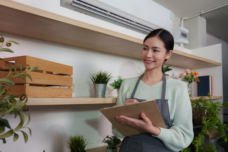 Eco-Friendly Practices. Happy woman documenting plant care in a sustainable shop environment.