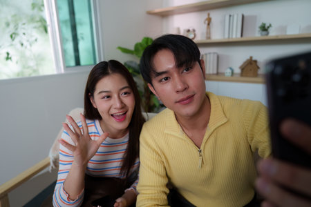 Friendly Interaction. Young couple capturing a selfie while enjoying time together.