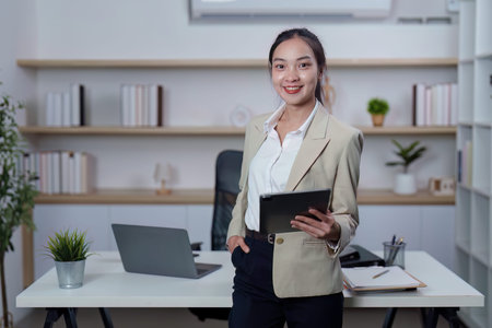 Confident Businesswoman with Tablet in Modern Office