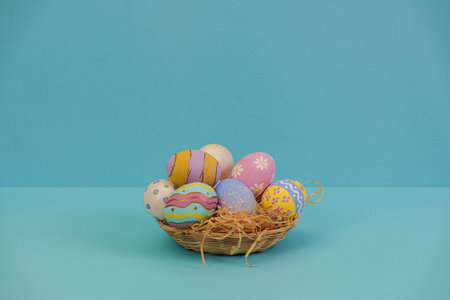 Easter Eggs. Beautifully painted eggs in a woven basket for spring festivities.