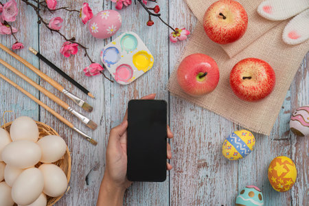 Artistic preparation with eggs and smartphone.