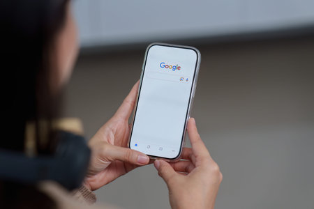 CHIANG MAI ,THAILAND - MAR 18, 2026 : A women using google to do a search
