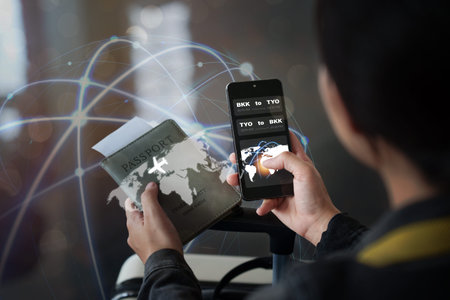 Person holding passport and smartphone for digital travel booking