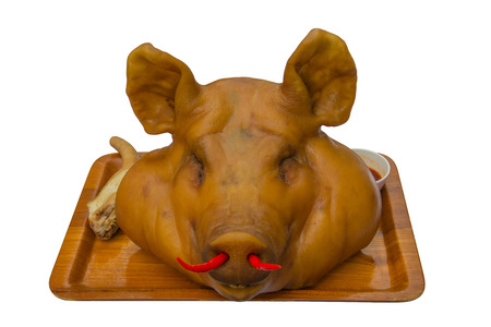 isolated and path of pig head is chinese traditional food for pray form immortalの写真素材
