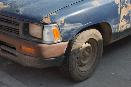 blue old car the skin is broken and rustの写真素材