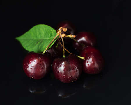 sweet cherries on a black background