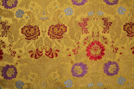 Brocade is a universal fabric that is used for tailoring, as well as for the production of textiles and furniture upholsteryの写真素材