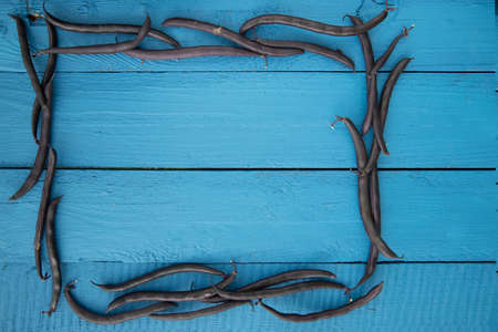 A frame made from asparagus bean pods is a source of vegetable protein. The concept of healthy eating. Place for Kopi spaceの写真素材