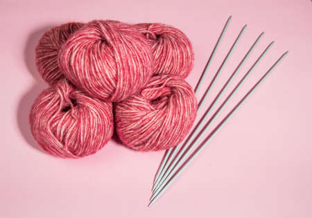 Colorful yarn balls over white background. Copy space