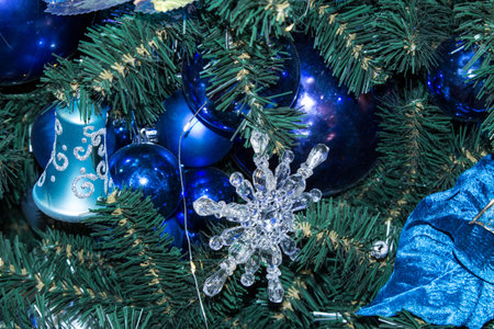 Artificial fir tree with Christmas decorations in blue and blue color scheme. Close up. Christmas backgroundの写真素材