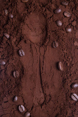 The imprint of a coffee spoon on the ground coffee.の写真素材