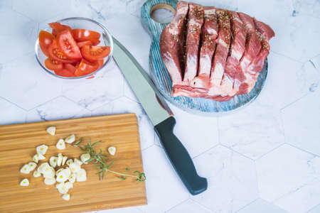 The concept of cooking raw pork meat at home.の写真素材
