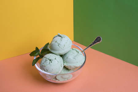 Ice cream with green matcha tea on bright colored backgrounds.の写真素材