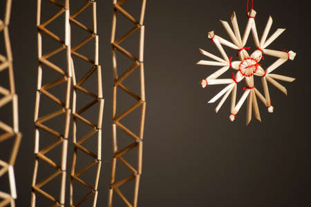 Closeup with straw star and strings of reedsの写真素材