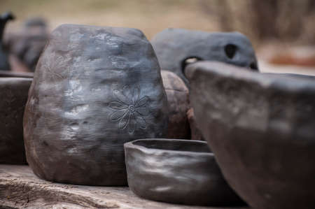 Unique handmade black pottery from clay just taken out from kilnの写真素材