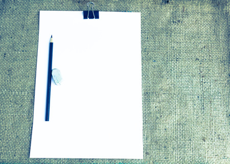 Blank note paper with pencil and rubber on sack background - Vintage effect style picturesの写真素材