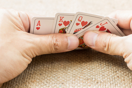 Closeup of hands with playing cards