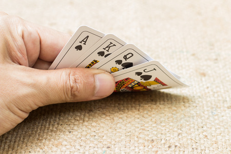 Closeup of hands with playing cards