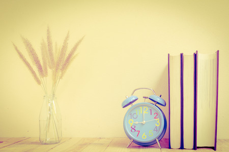 Alarm clock with book - Vintage effect style picturesの写真素材